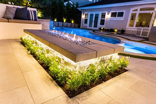 Linear Stone Firepit with Poured Concrete Cap & Planting