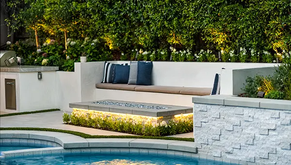 Built-In Smooth Stucco Bench and Stone Linear Firepit