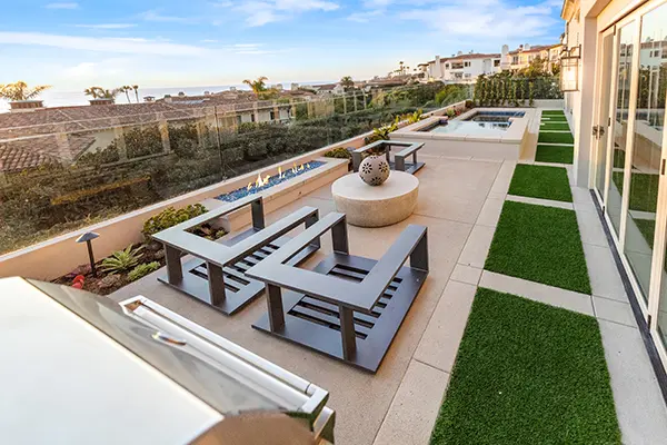 Outdoor Seating Area with Built-In Linear Firepit & Turf Areas